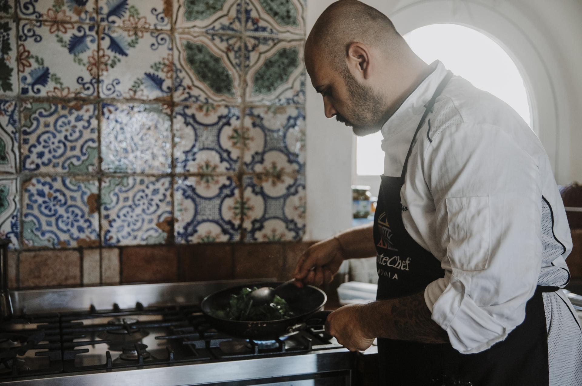 Our chef cooking with a pan
